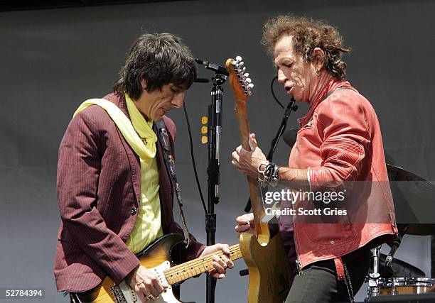 Keith Richards and Ron Wood of The Rolling Stones perform onstage during a press conference to announce a world tour at the Julliard Music School May...