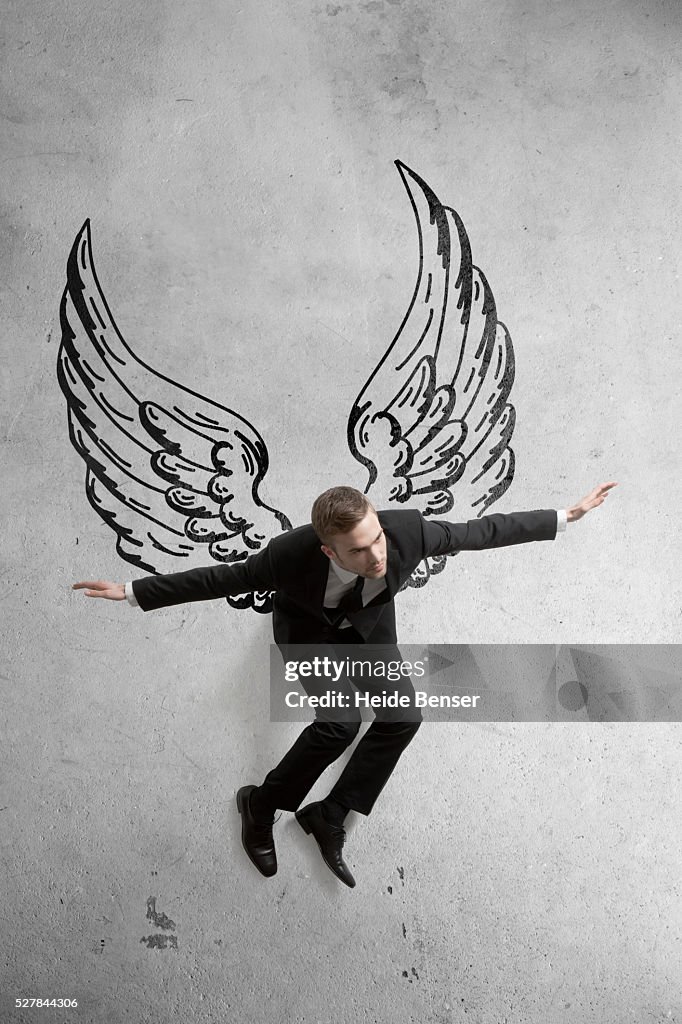 Small Flying Man Person Flying With Wings