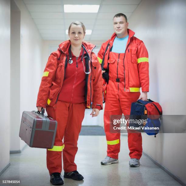 two paramedics at work - rescue worker foto e immagini stock