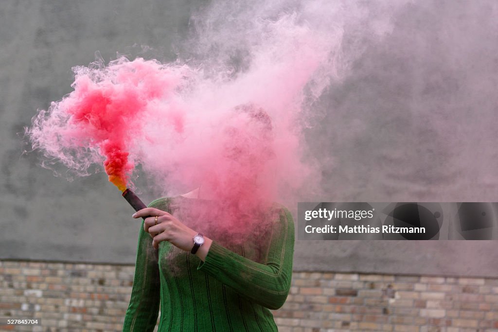 Young woman with smoke