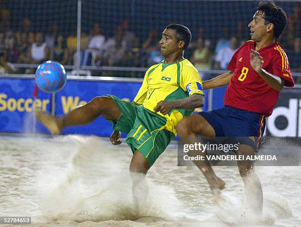 Brazil's Romario and Spain's Samuel Vasquez vie for the ball during their Fifa Beach Soccer World Cup match in Copacabana beach, Rio de Janeiro,...