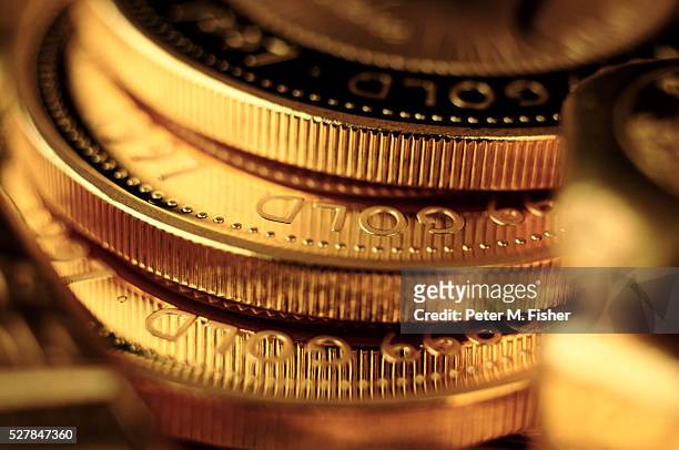 gold coins - capitalism stock pictures, royalty-free photos & images