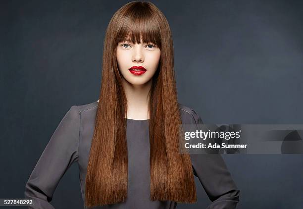 studio shot of a brunette with long straight hair - pale complexion stock-fotos und bilder