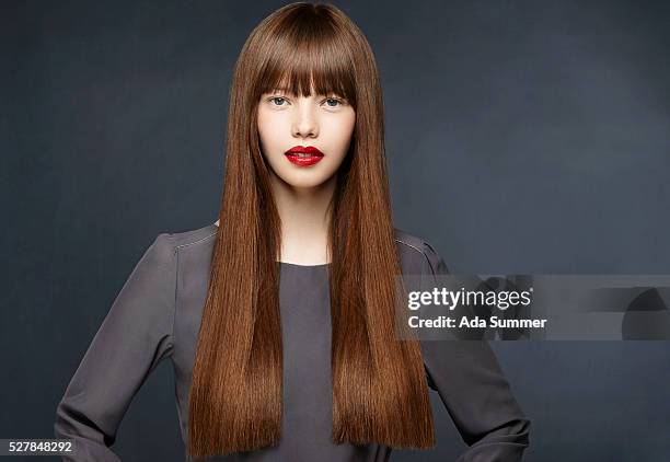 studio shot of a brunette with long straight hair - lightskinned stock pictures, royalty-free photos & images