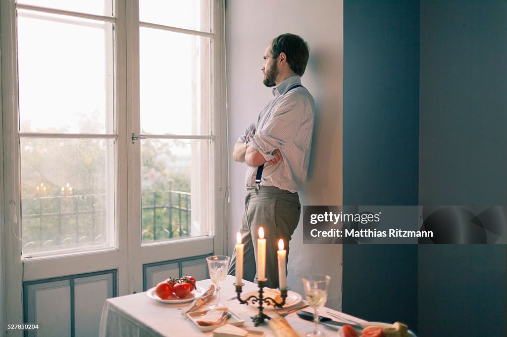 Man waiting at dinner table