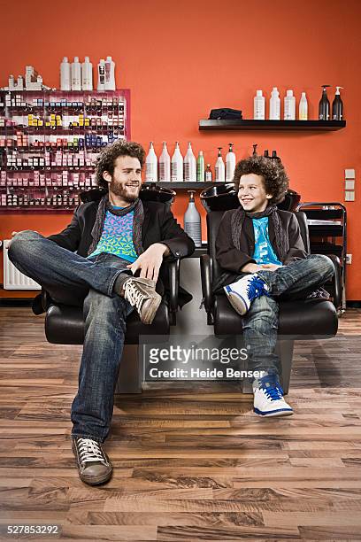 man and boy with afro hair looking at each other, portrait - father son admiration stock pictures, royalty-free photos & images
