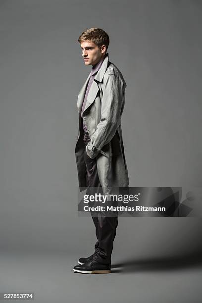 portrait of man in grey coat - overcoat stock pictures, royalty-free photos & images