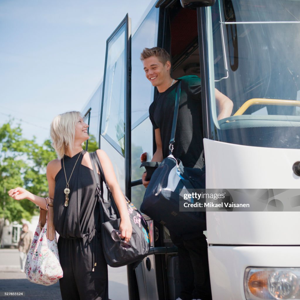 Getting Off Young Man And Woman Getting Off Bus High-Res Stock Photo - Getty Images