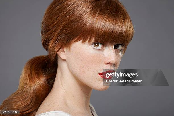 studio portrait of young woman wearing lipstick - bangs stock pictures, royalty-free photos & images