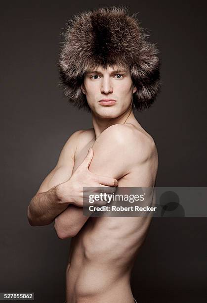 topless young male adult wearing a fur hat - fur hat stock pictures, royalty-free photos & images