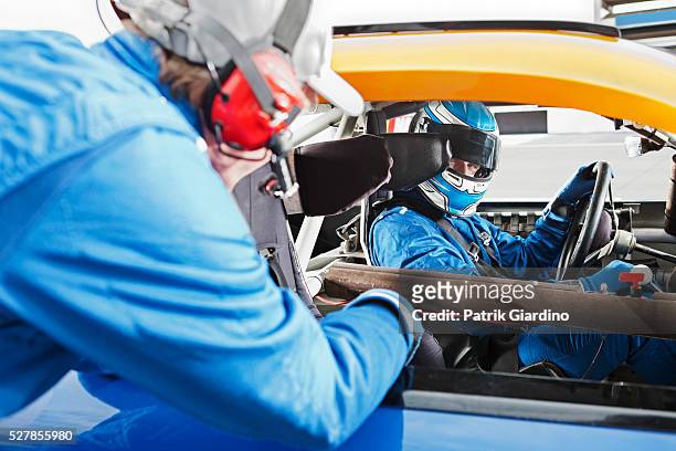 race car drivers talking before race - nascar driver stock pictures, royalty-free photos & images