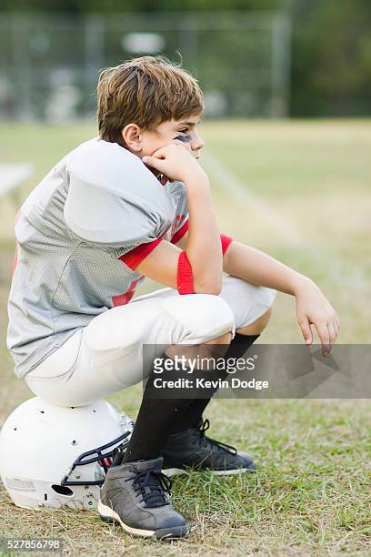 waiting for a turn to play - american football uniform stock pictures, royalty-free photos & images