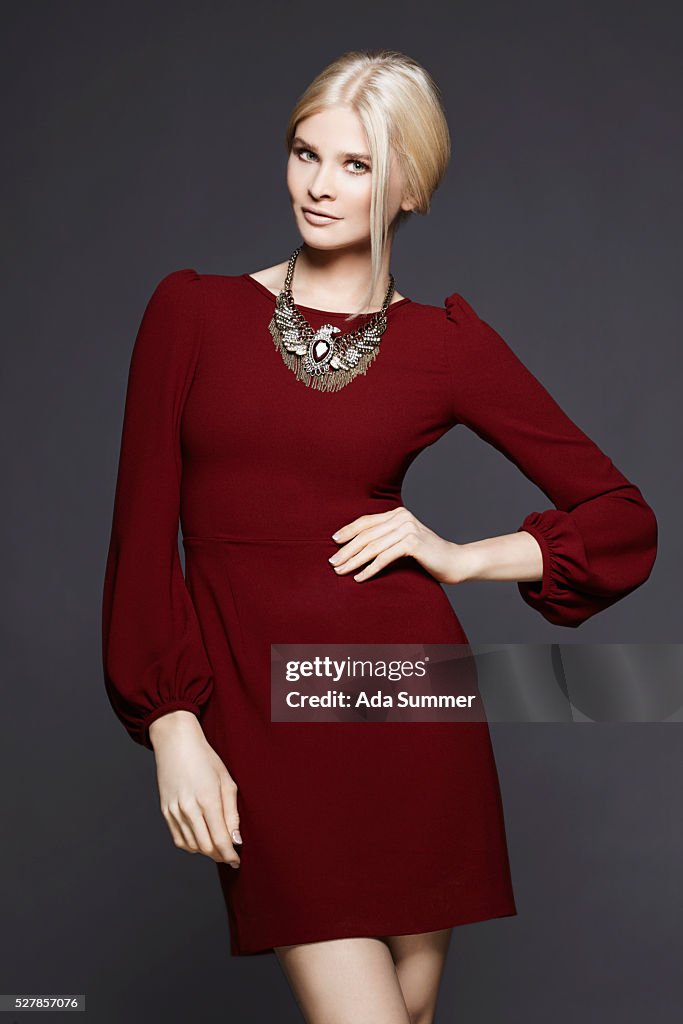 Woman in red dress with necklace