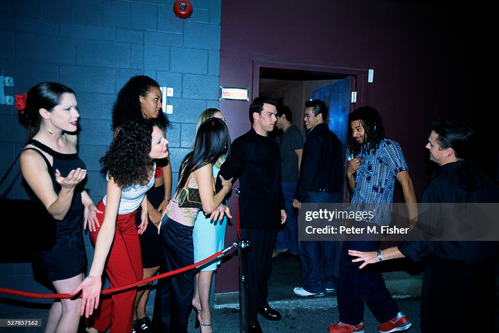 Bouncer Allowing Men into Nightclub