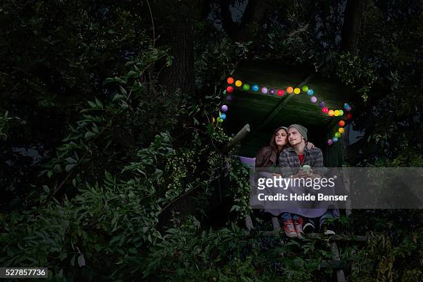couple sitting in a secluded hut - tree house bildbanksfoton och bilder