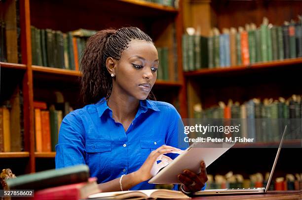 young adult in library - archival library stock pictures, royalty-free photos & images