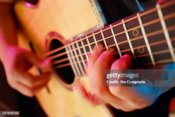 man playing acoustic guitar - jim craigmyle guitar stock pictures, royalty-free photos & images