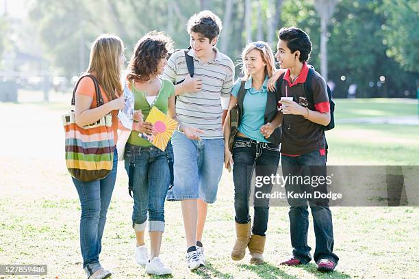 teenage friends in park - teenagers only imagens e fotografias de stock