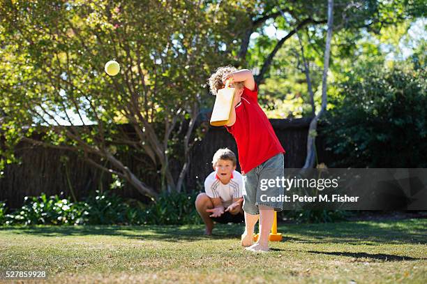 boys playing cricket in backyard - backyard cricket stock pictures, royalty-free photos & images