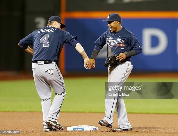 Reid Brignac and Erick Aybar of the Atlanta Braves celebrate the 3-0 win over the New York Mets at Citi Field on May 3, 2016 in the Flushing...