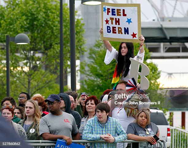 Campaign supporters show their support for Democratic presidential candidate Bernie Sanders as he speaks to them during a campaign rally at the Big...