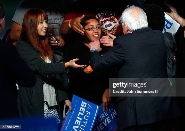 Democratic presidential candidate Bernie Sanders shakes hands with campaign supporters after a campaign rally at the Big Four Lawn park May 3, 2016...