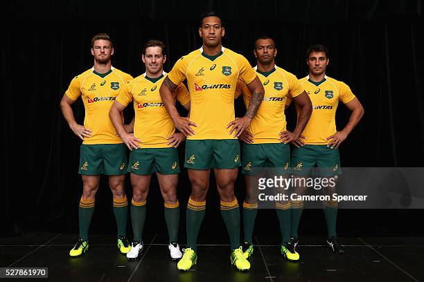 Australian Wallabies Rob Horne, Bernard Foley, Israel Folau, Kurtley Beale and Nick Phipps pose in the new Asics Wallabies jersey during the...