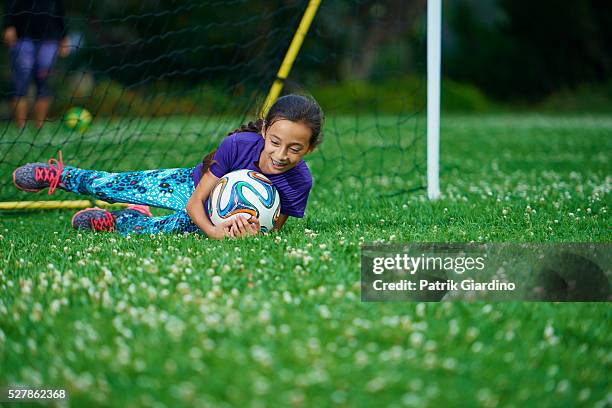 kids playing soccer - girl goalie stock pictures, royalty-free photos & images