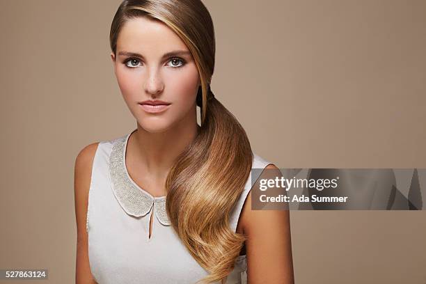 woman with ponytail - shiny hair back stock pictures, royalty-free photos & images