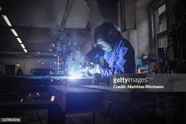welder at work - welder stock pictures, royalty-free photos & images