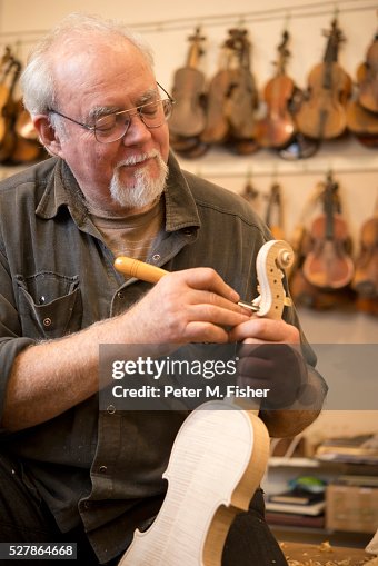 Violin maker makes violin using traditional tools Violin maker makes violin using traditional tools