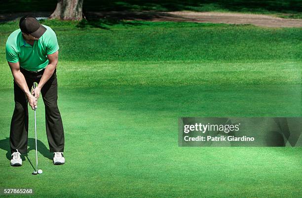 young man plying golf - bent golf club stock pictures, royalty-free photos & images