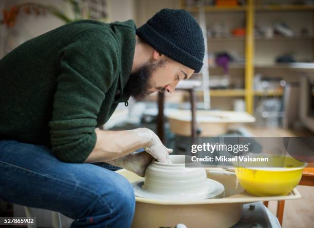 art school student working with clay - man pottery stock pictures, royalty-free photos & images