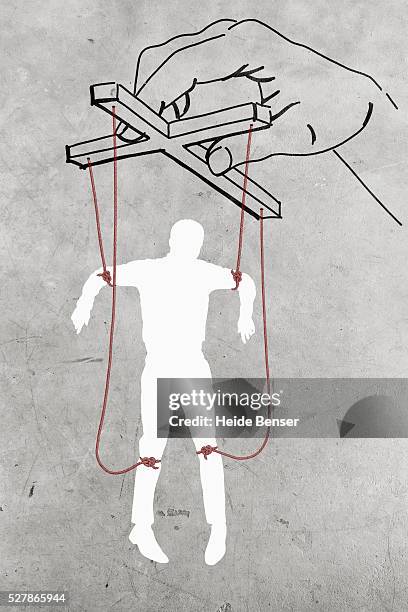 silhouette of man dangling on threads - hand puppet stock-fotos und bilder
