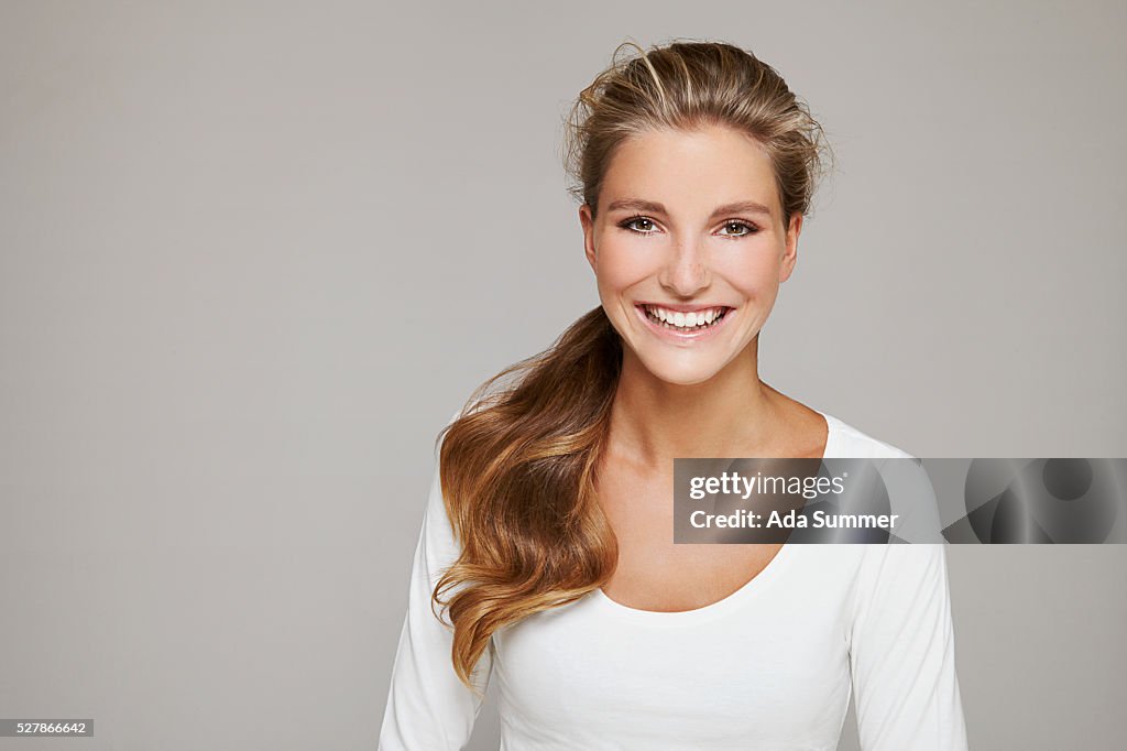 Portrait of young woman with ponytail