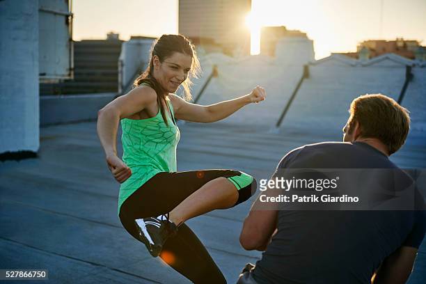 woman training martial arts with man - kickboxing fitness stock pictures, royalty-free photos & images