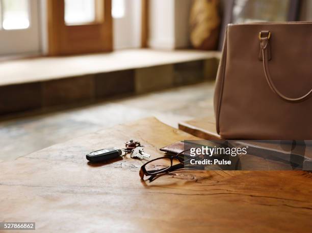 alarm device with glasses and wallet on table. - car keys table stock pictures, royalty-free photos & images