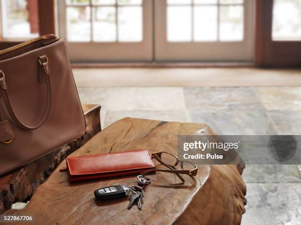 alarm device with glasses and wallet on table. - car keys table stock pictures, royalty-free photos & images