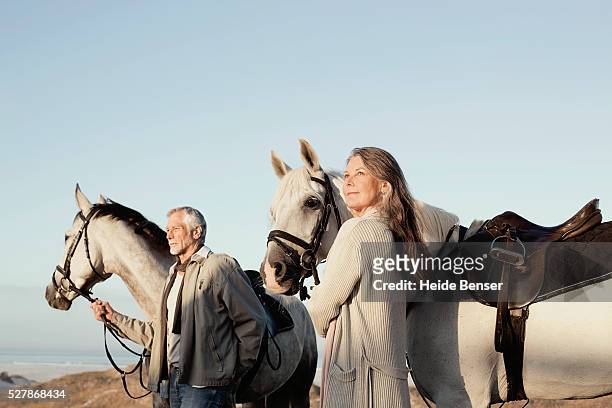couple horseback riding - country western outside stockfoto's en -beelden