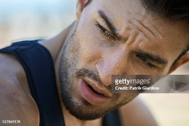 young man exercising, sweating - sweat stock-fotos und bilder