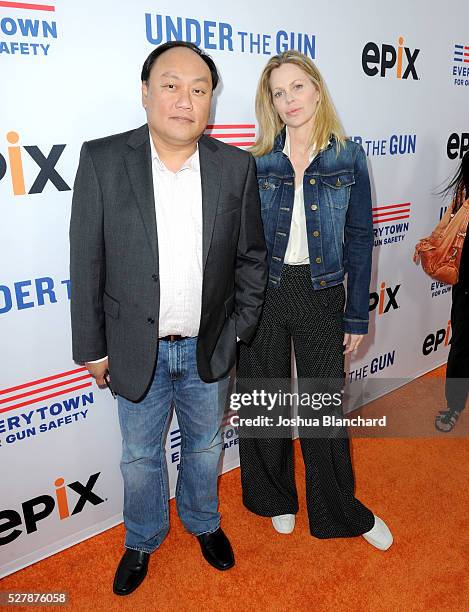 Produer Manny Oteyza and actress Kristin Bauer Van Straten attend the "Under The Gun" LA premiere featuring Katie Couric and Stephanie Soechtig at...