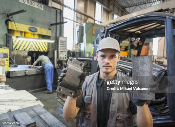 young industrial worker in steel processing factory - mann vorher nachher stock-fotos und bilder