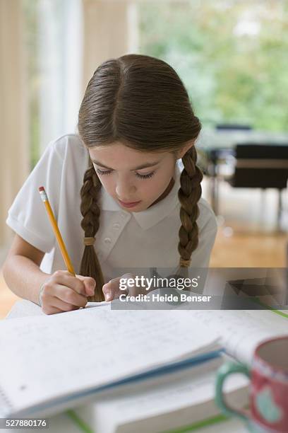 girl working on homework - codino foto e immagini stock