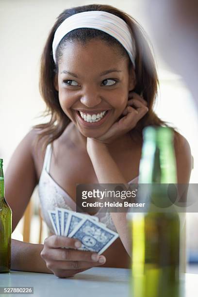 https://media.gettyimages.com/id/527880226/photo/woman-playing-strip-poker.jpg?s=612x612&w=gi&k=20&c=YeiyhtsEfhIZdEilbt63tSlazvjZMSCZrwKQ2bC-giA=