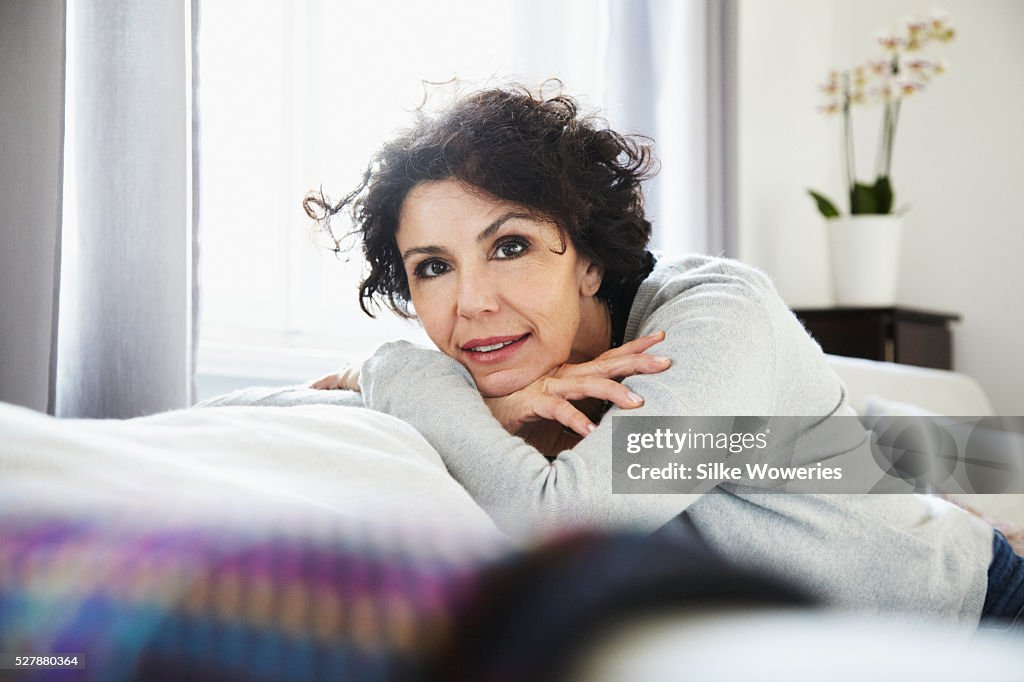 Portrait of relaxed woman in living room