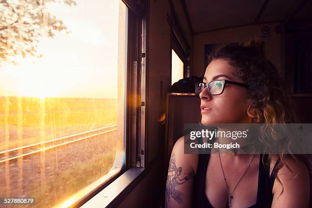 young american travels thailand by train at sunrise - sabbatical stockfoto's en -beelden