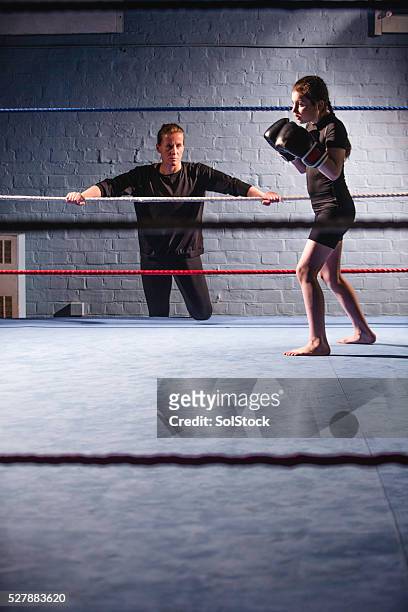 she has a good strong kick - boxing trainer stock pictures, royalty-free photos & images