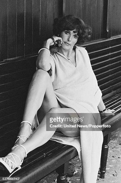 American actress and editor of High Society magazine, Gloria Leonard pictured sitting on a bench in London on 6th September 1977.