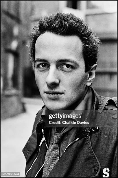 Singer-songwriter Joe Strummer of British punk group The Clash, in an alleyway in Central London, April 1977.