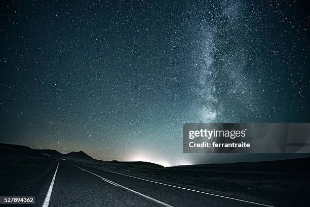 road trip under the milky way - night road stock pictures, royalty-free photos & images